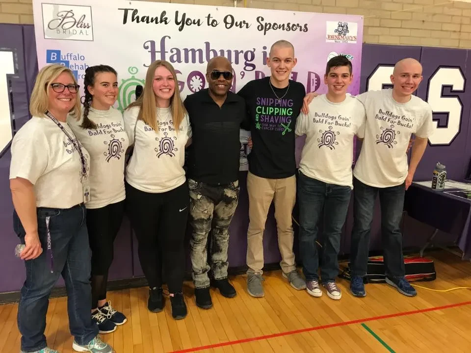 DJ Anthony with students at a Goin' Bald for Bucks event in Hamburg, NY